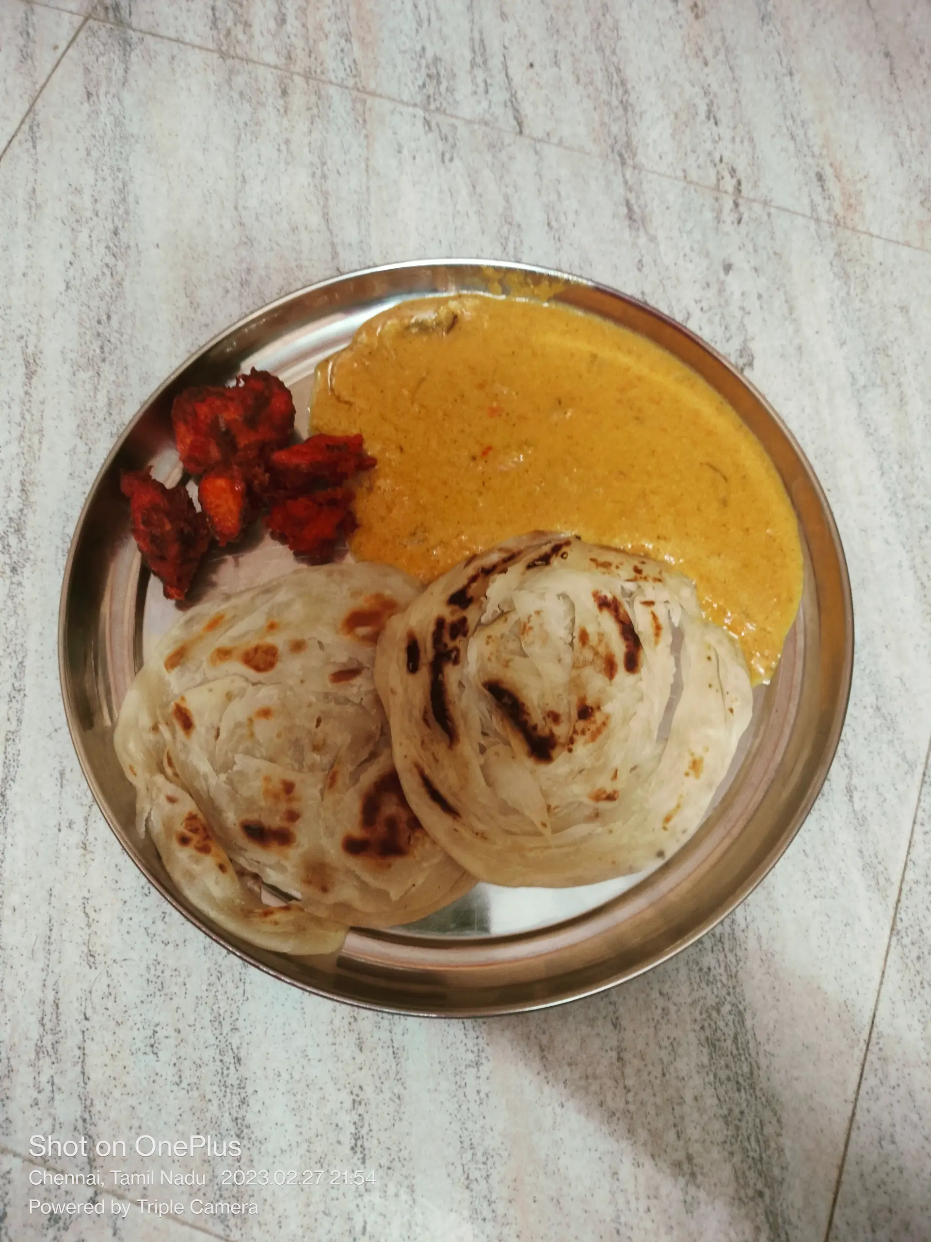 A cook's photo of Parotta