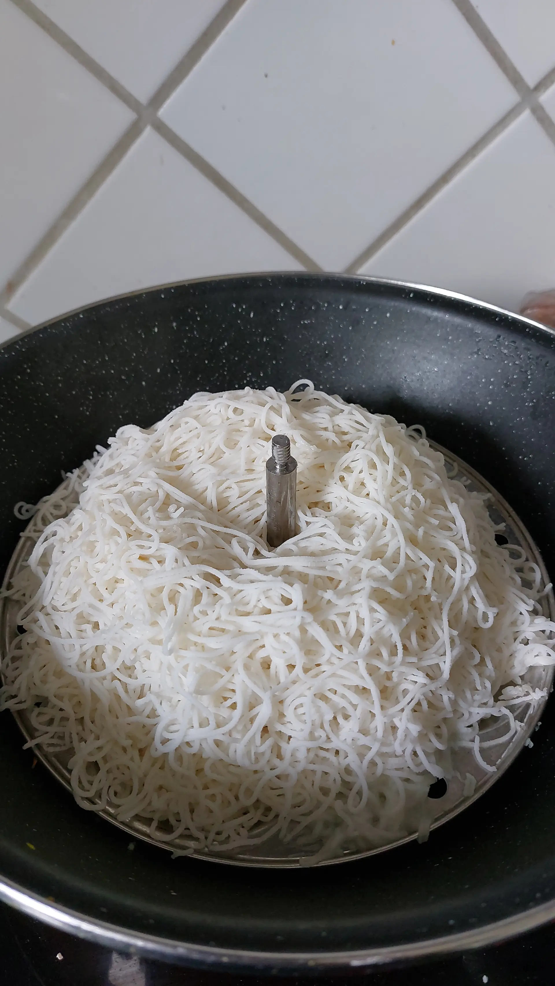 A cook's photo of Idiyappam and Coconut Milk