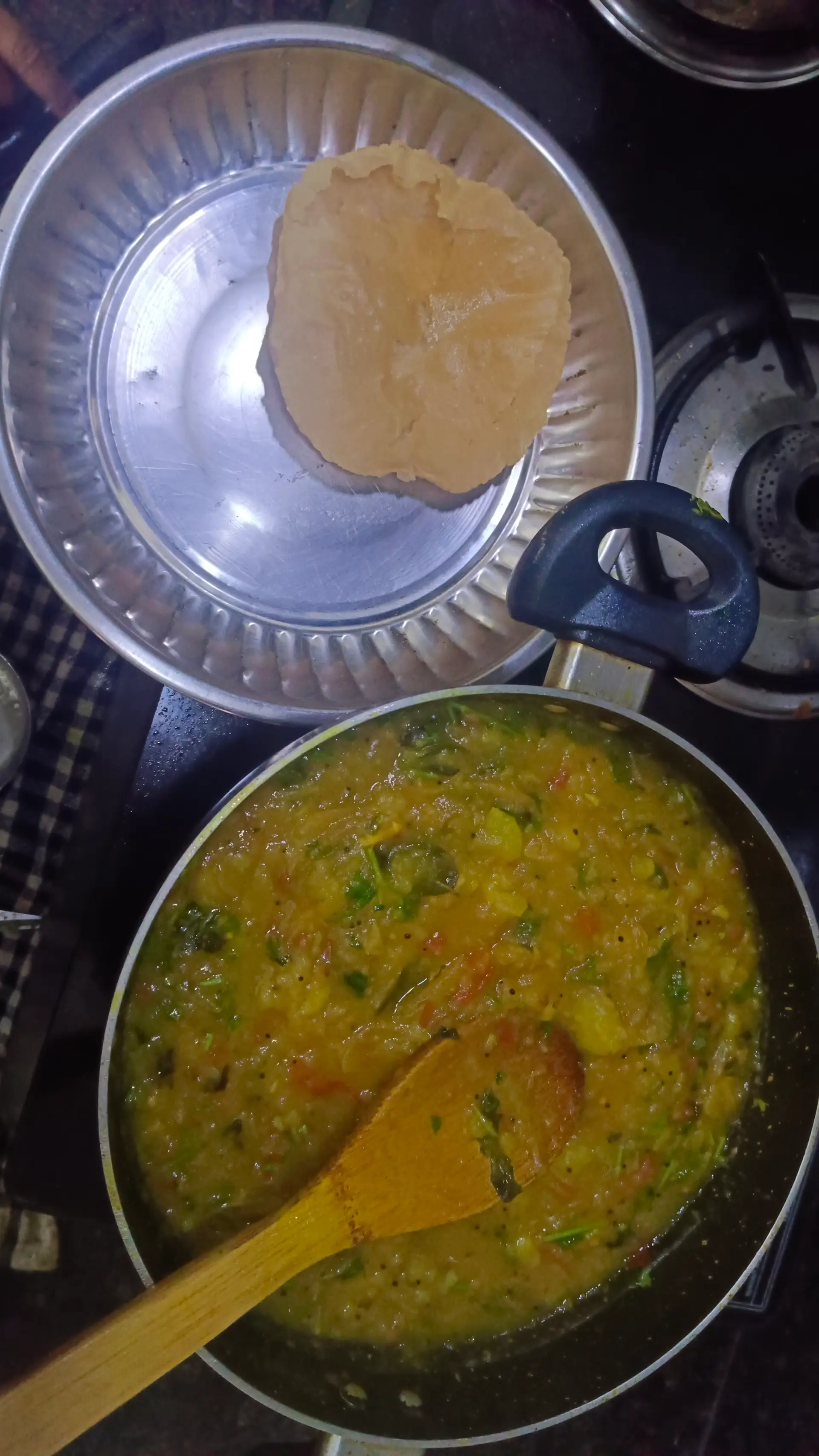 A cook's photo of Poori Masala
