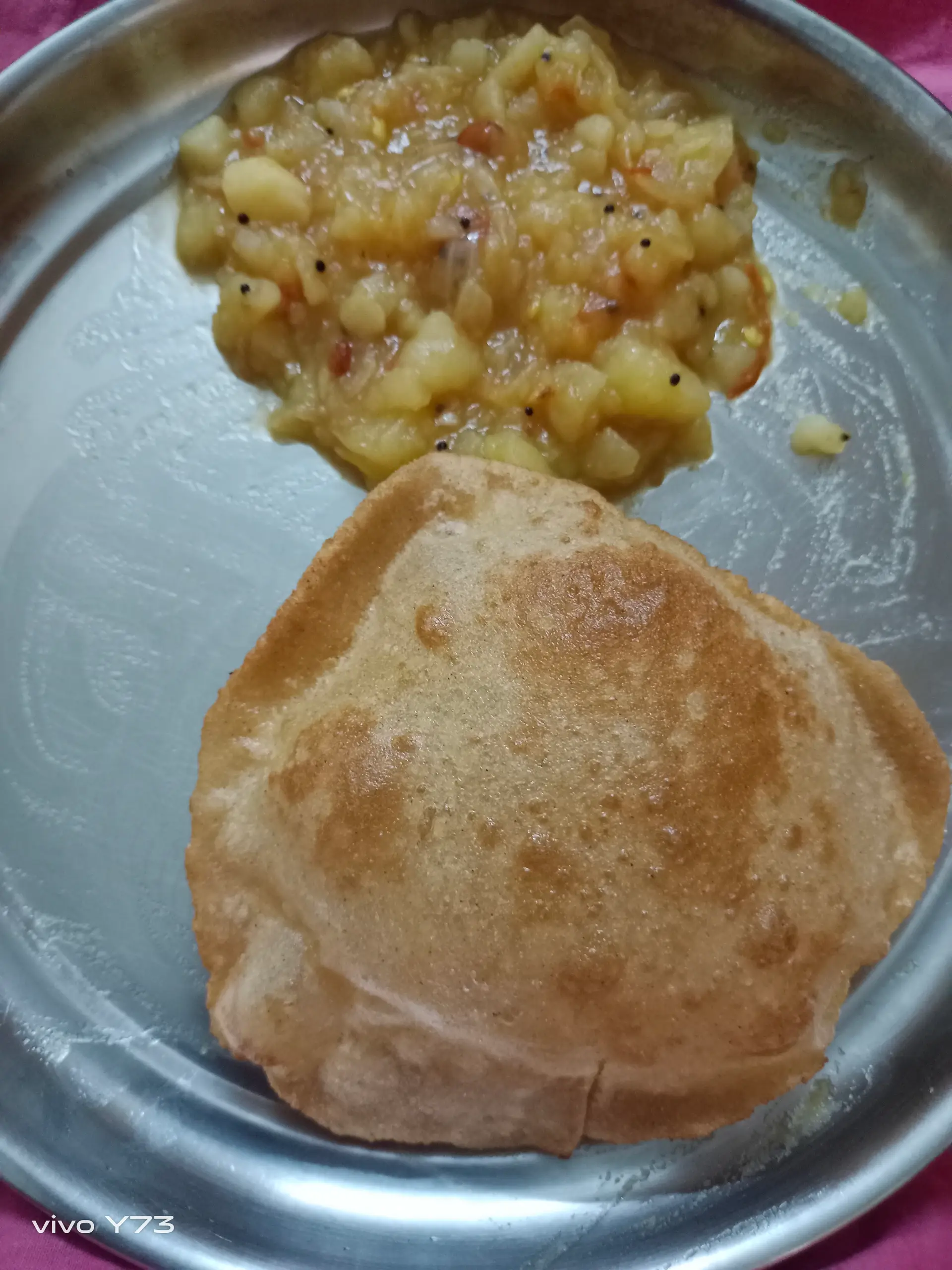 A cook's photo of Poori Masala
