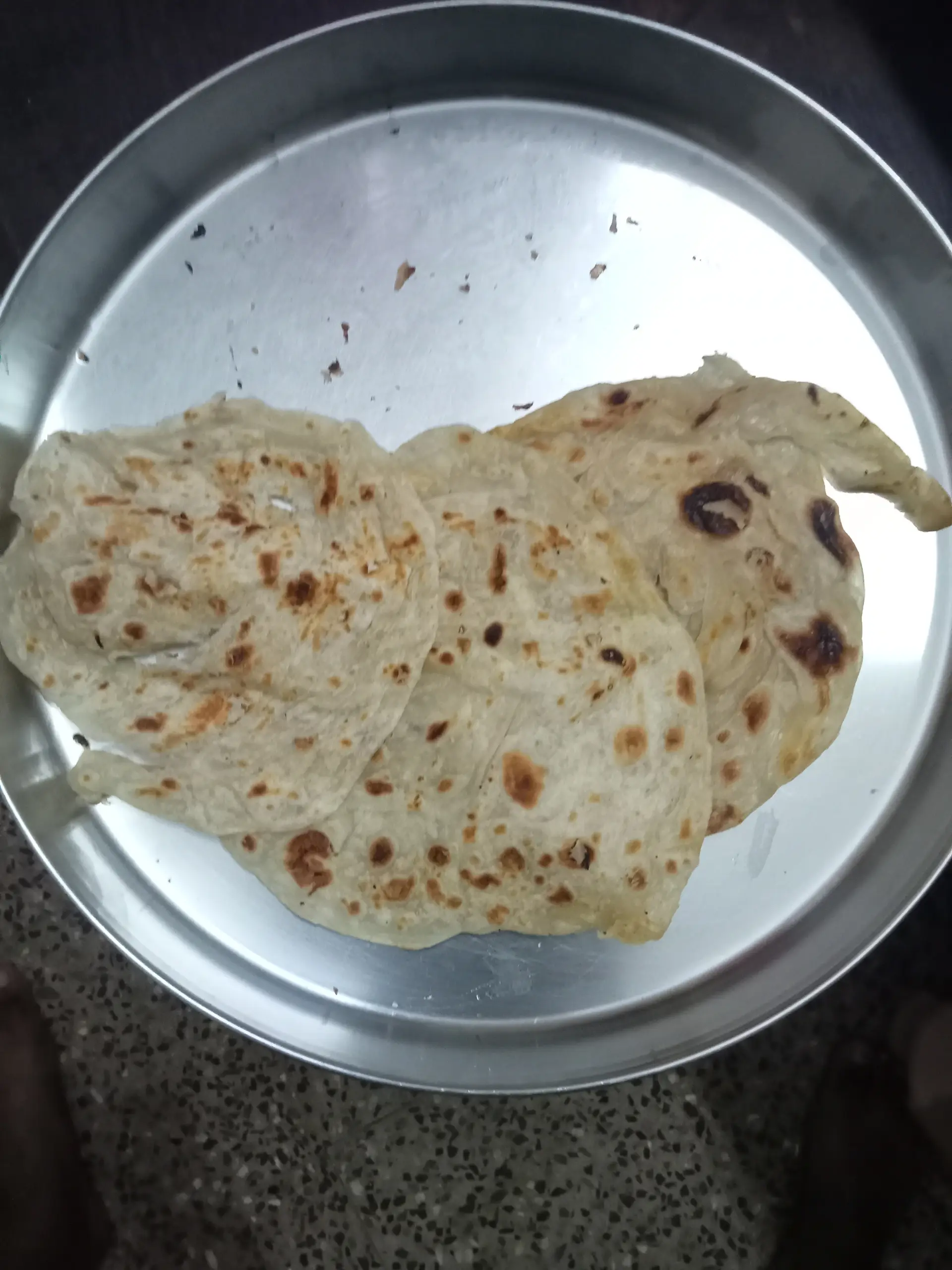 A cook's photo of Parotta