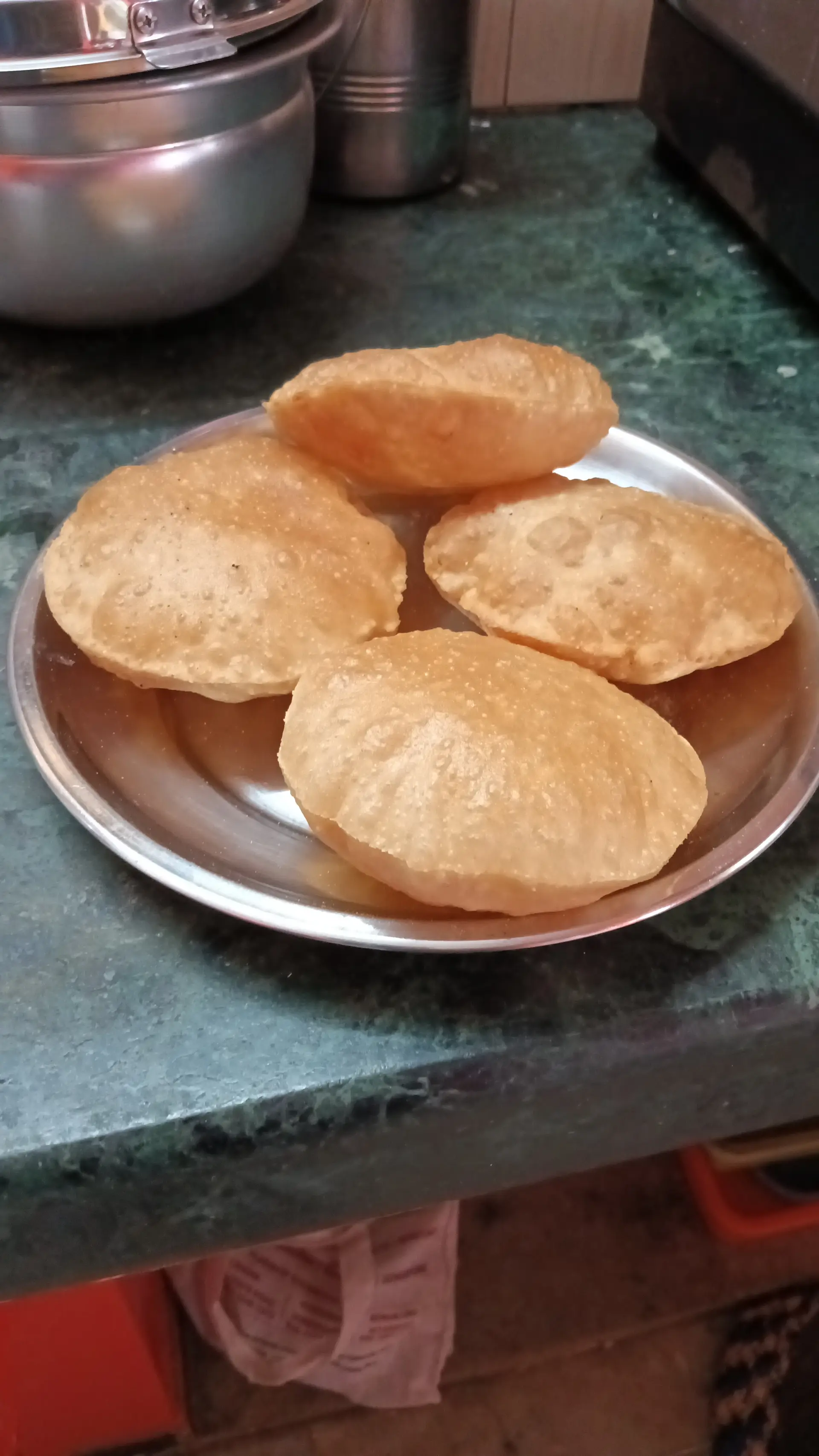 A cook's photo of Poori